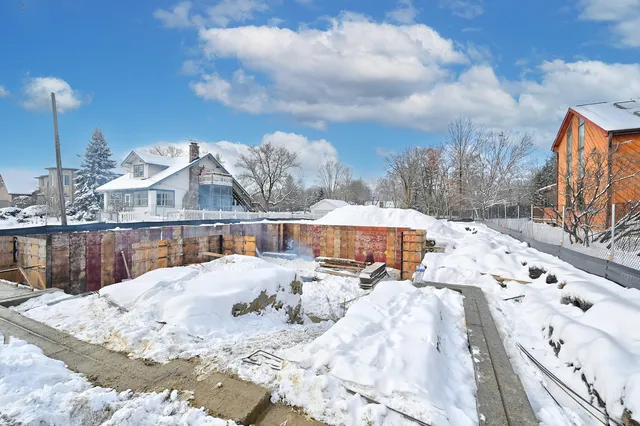a view of roof with wooden fence