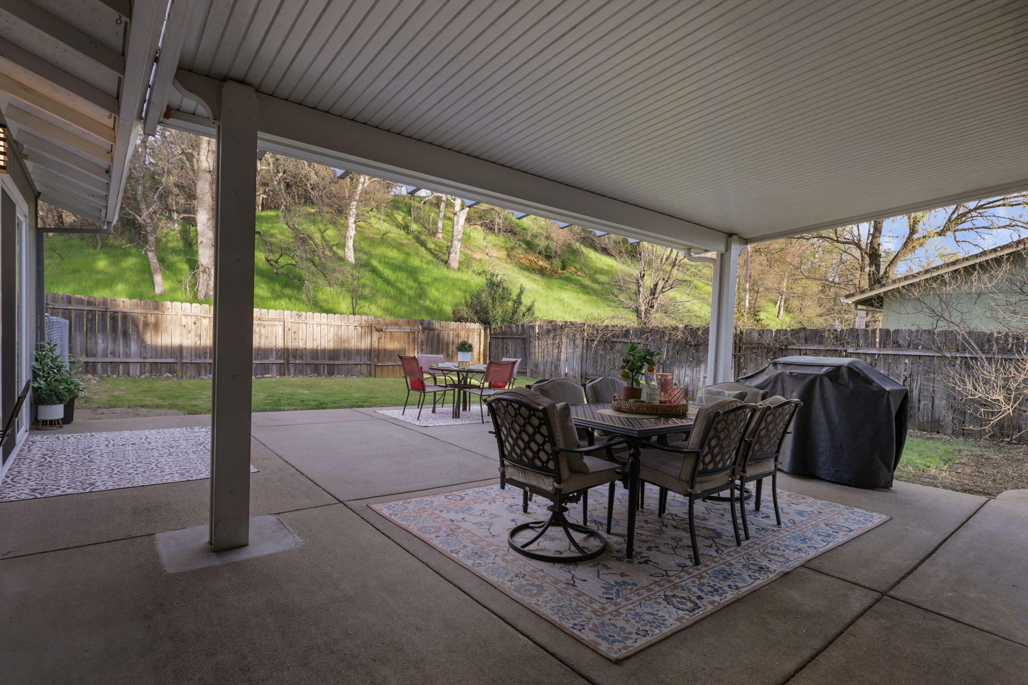 61 Tidmore Lane Redding, CA 96003 - Photo 28 of 38 a view of a patio with table and chairs