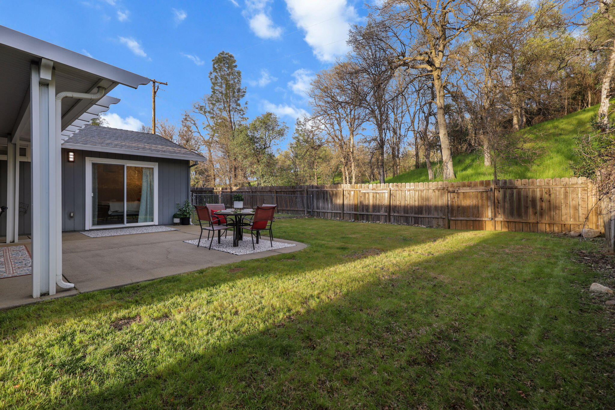61 Tidmore Lane Redding, CA 96003 - Photo 30 of 38 a view of a house with backyard and sitting area