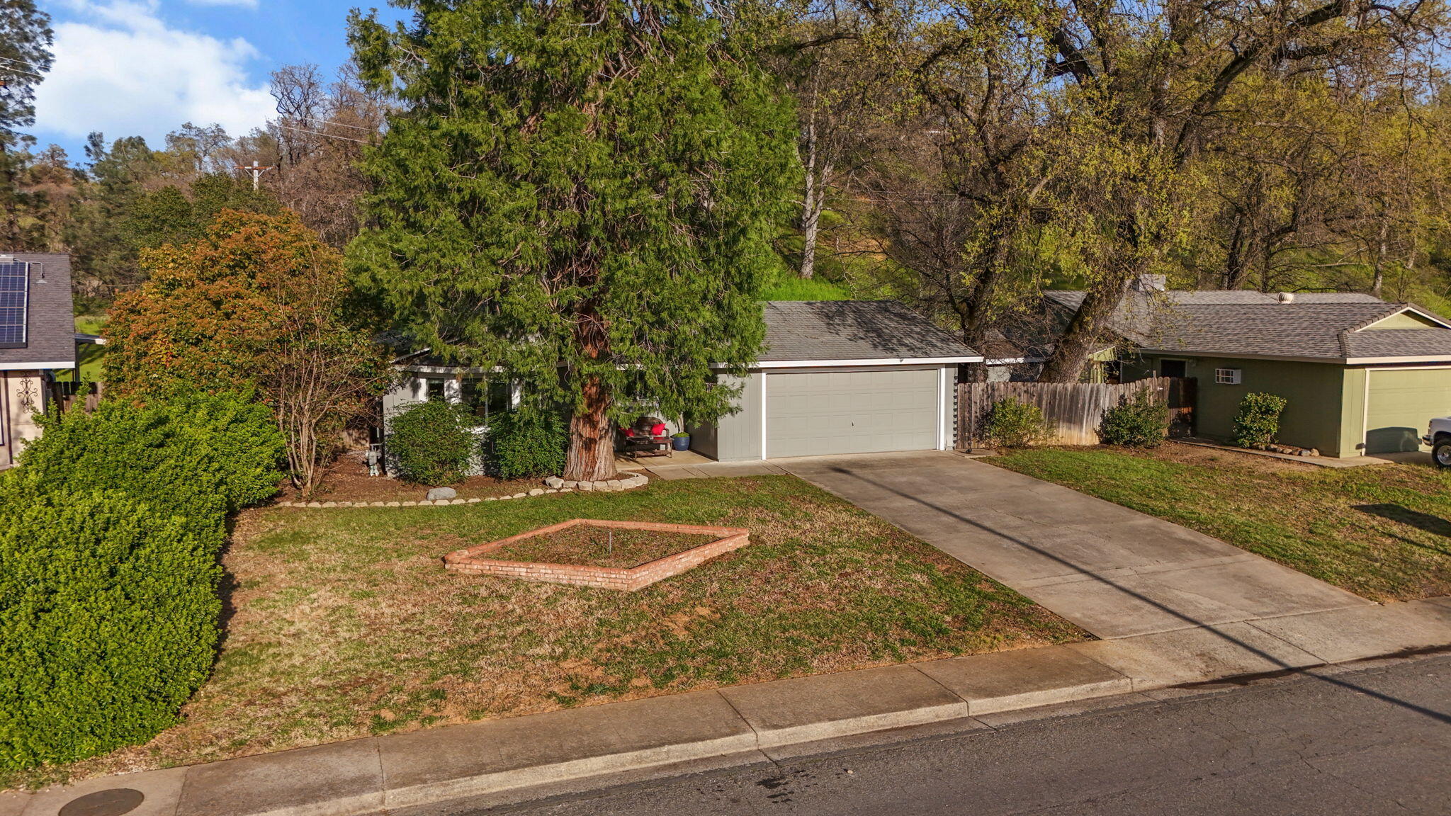 61 Tidmore Lane Redding, CA 96003 - Photo 36 of 38 a front view of a house with a yard