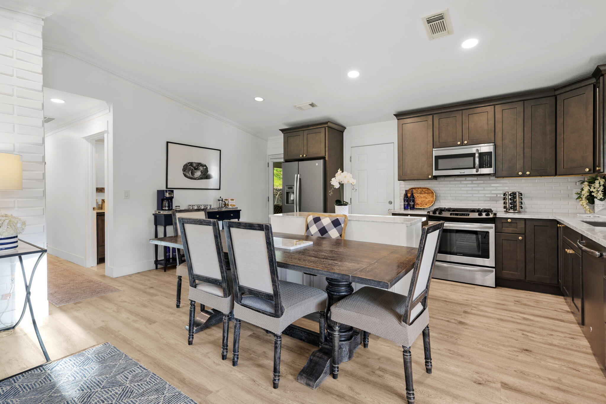 61 Tidmore Lane Redding, CA 96003 - Photo 6 of 38 a view of kitchen with cabinets table and chairs