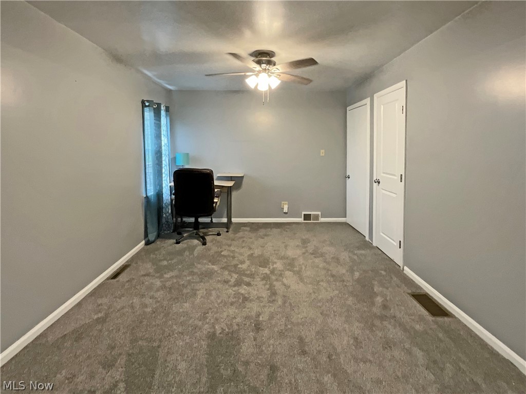 1386 Hall's Road Colliers, WV 26035 - Photo 7 of 17 Office area featuring ceiling fan and dark colored carpet