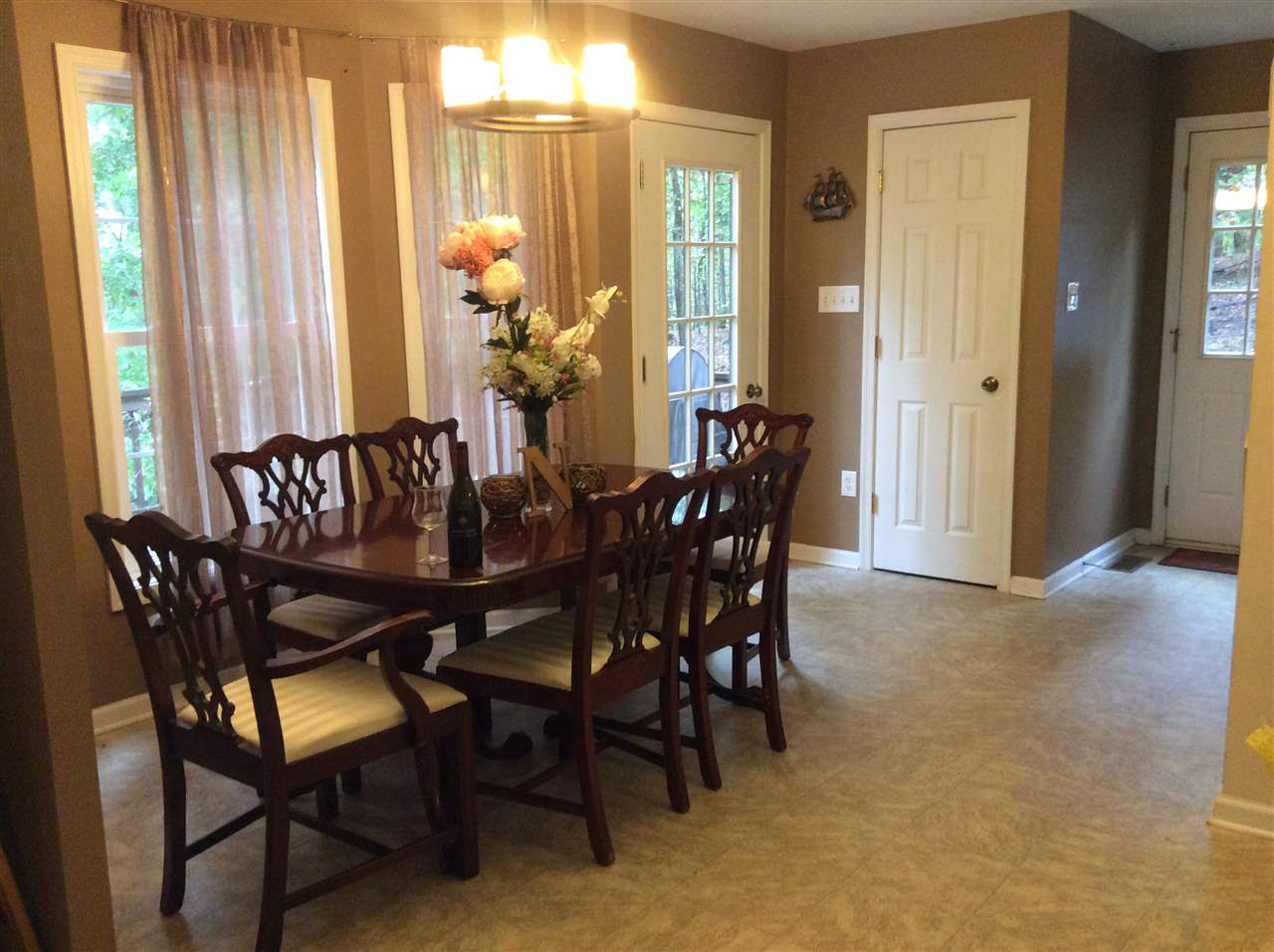 4003 Ruth Road Madison, VA 22727 - Photo 15 of 38 a view of a dining room with furniture and chandelier