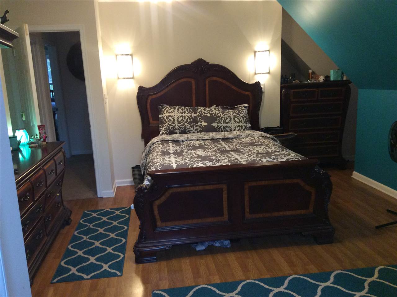 4003 Ruth Road Madison, VA 22727 - Photo 20 of 38 a bedroom with a bed and a lamp on dresser