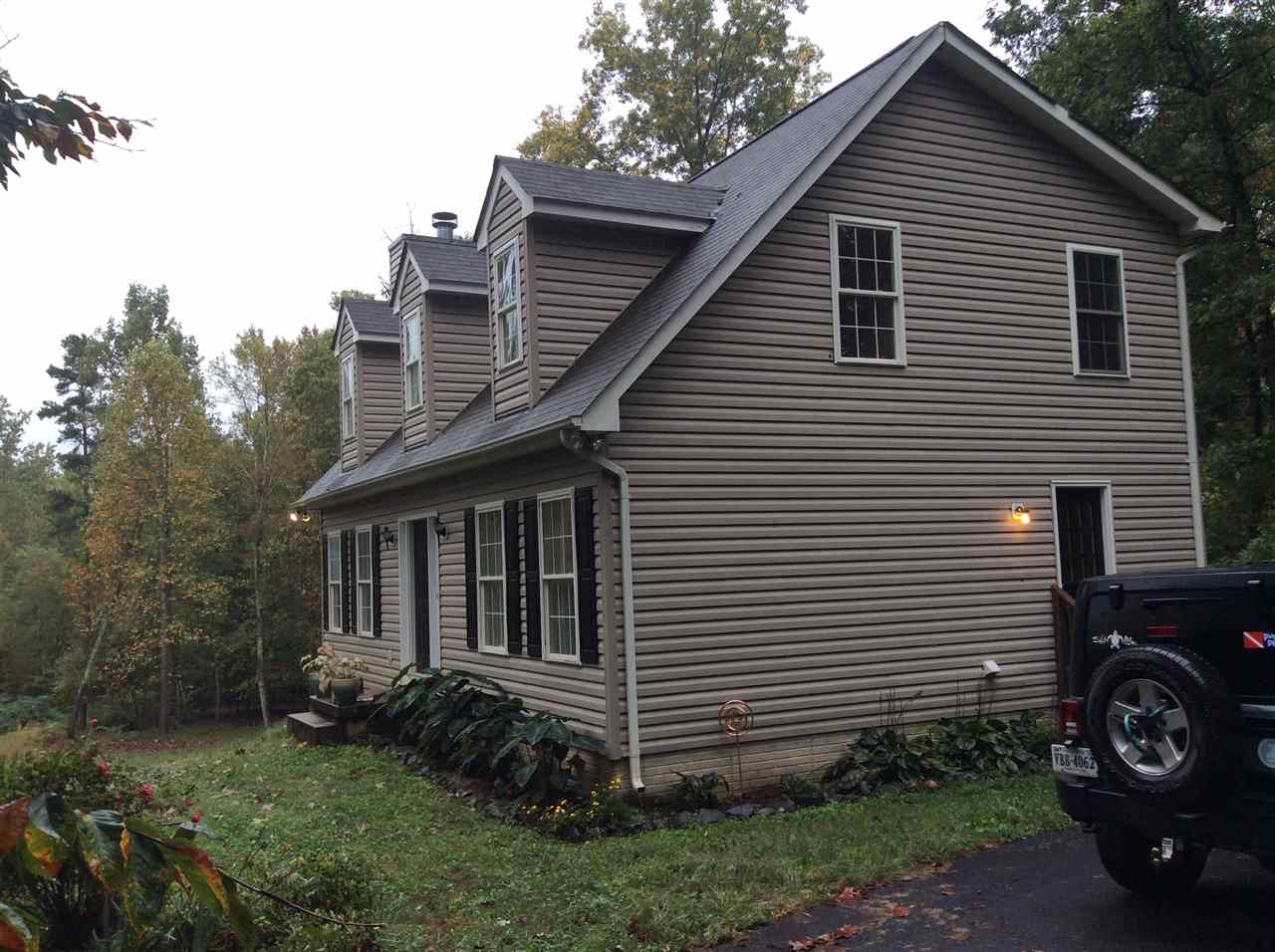 4003 Ruth Road Madison, VA 22727 - Photo 2 of 38 a front view of a house with garden