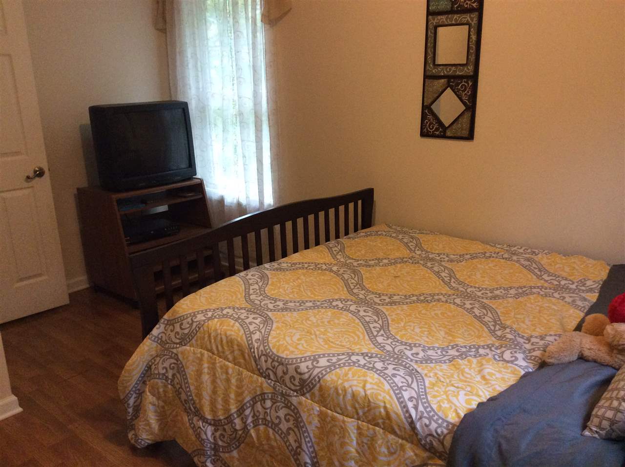 4003 Ruth Road Madison, VA 22727 - Photo 26 of 38 a bed sitting in a bedroom next to a window