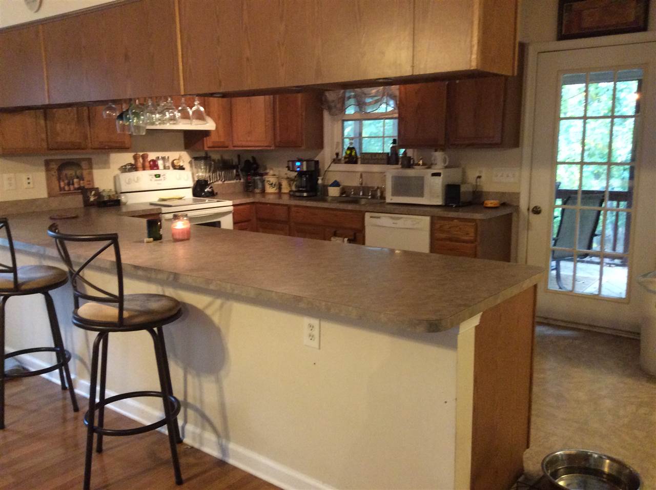 4003 Ruth Road Madison, VA 22727 - Photo 10 of 38 a kitchen with stainless steel appliances granite countertop a stove a sink a microwave and a refrigerator
