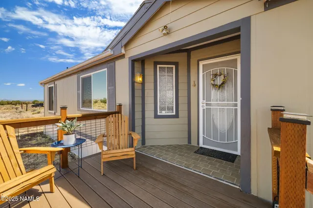 a view of a house with outdoor seating