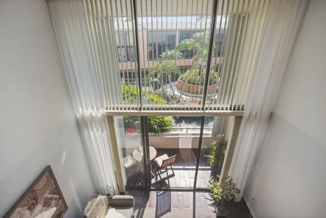a view of a balcony with chair