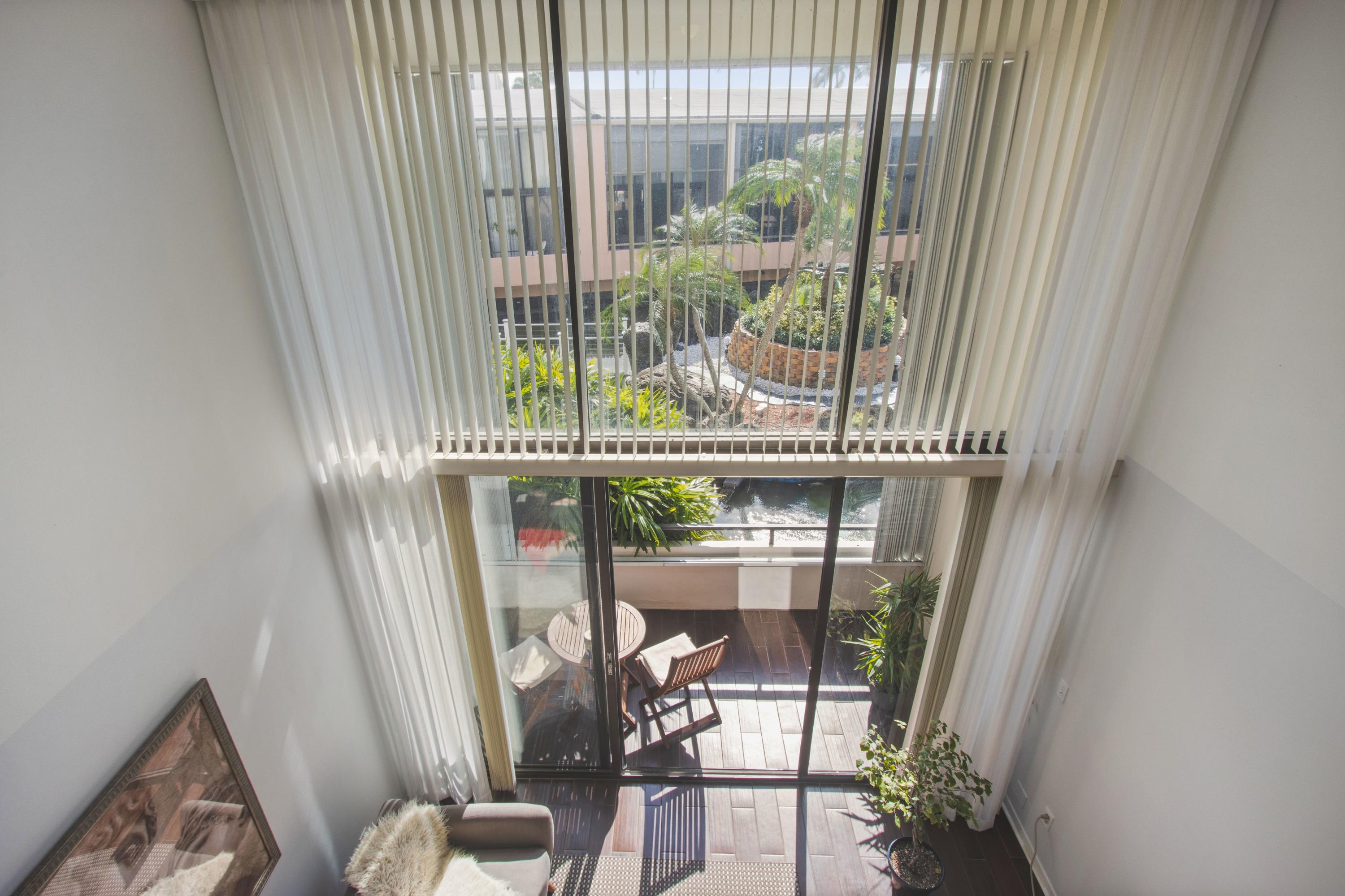 a view of a balcony with chair