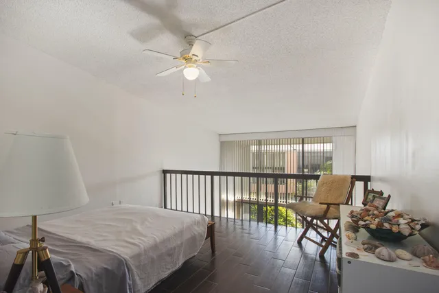 a bedroom with furniture and wooden floor