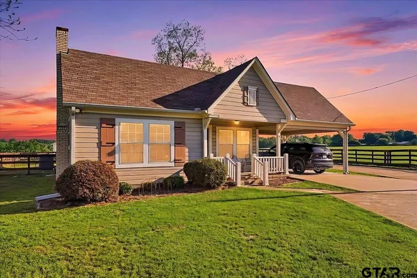 a front view of a house with patio