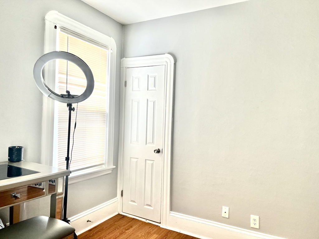 30 Rodney Street, Unit 2 New Bedford, MA 02744 - Photo 13 of 15 a view of a bathroom with mirror and a sink