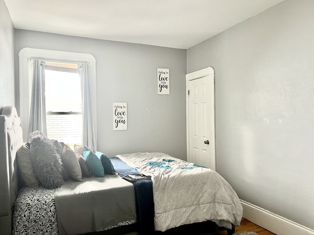 30 Rodney Street, Unit 2 New Bedford, MA 02744 - Photo 14 of 15 a bedroom with a bed and a window