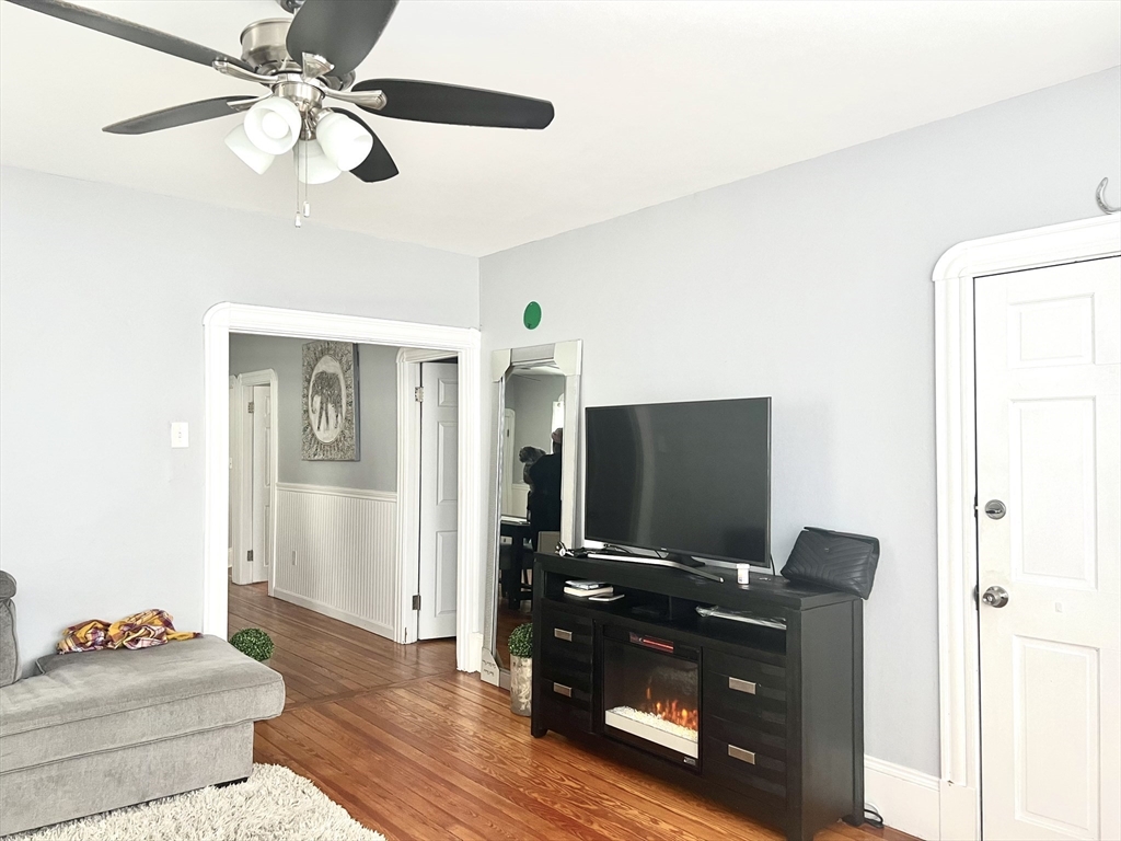 30 Rodney Street, Unit 2 New Bedford, MA 02744 - Photo 4 of 15 a living room with furniture and a flat screen tv