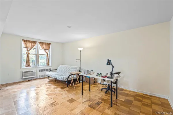 a view of a livingroom with furniture and a window