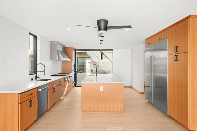 a kitchen with a stove and a refrigerator