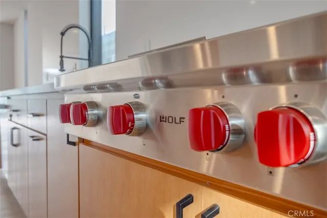 a large kitchen with stainless steel appliances granite countertop a sink and stove