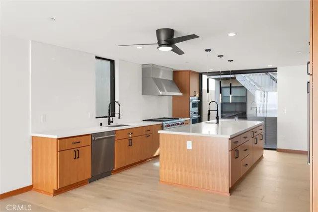 a view of a livingroom with a refrigerator a sink and dishwasher