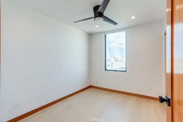 a kitchen with a sink and a wooden floor