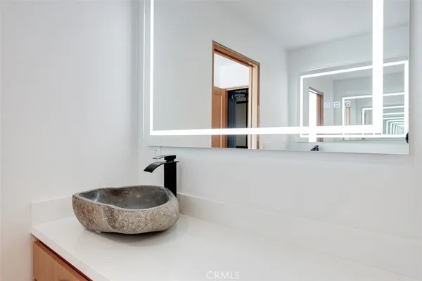a white bath tub sitting in a bathroom