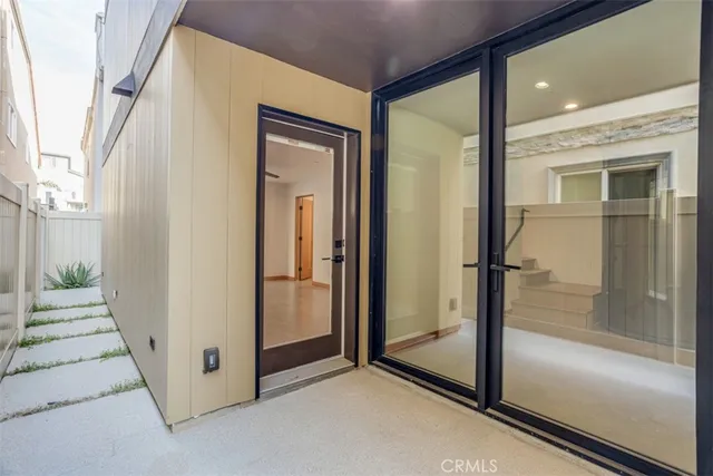 a bathroom with a toilet and a mirror