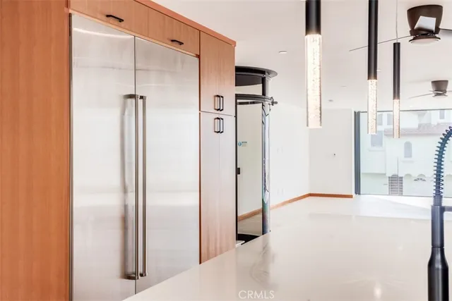 a kitchen with stainless steel appliances a stove a refrigerator and a sink