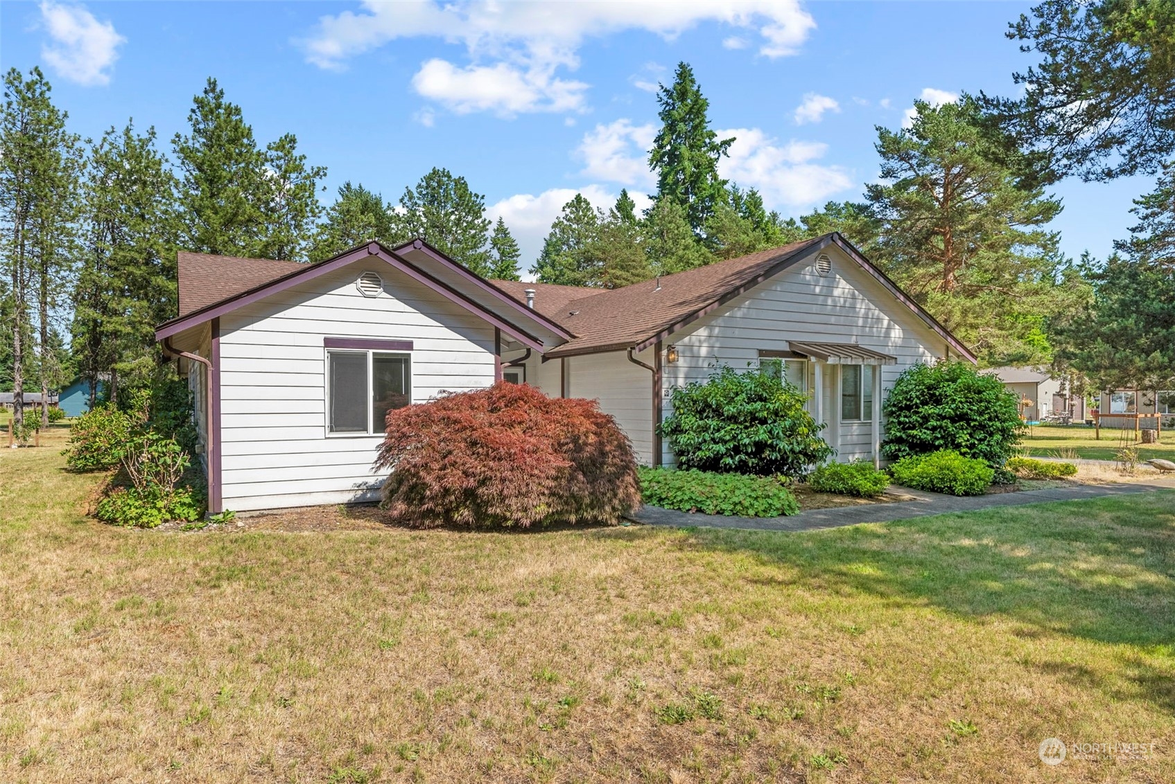 18728 Sams Place Southwest Rochester, WA 98579 - Photo 1 of 28 a house that has a tree in front of it