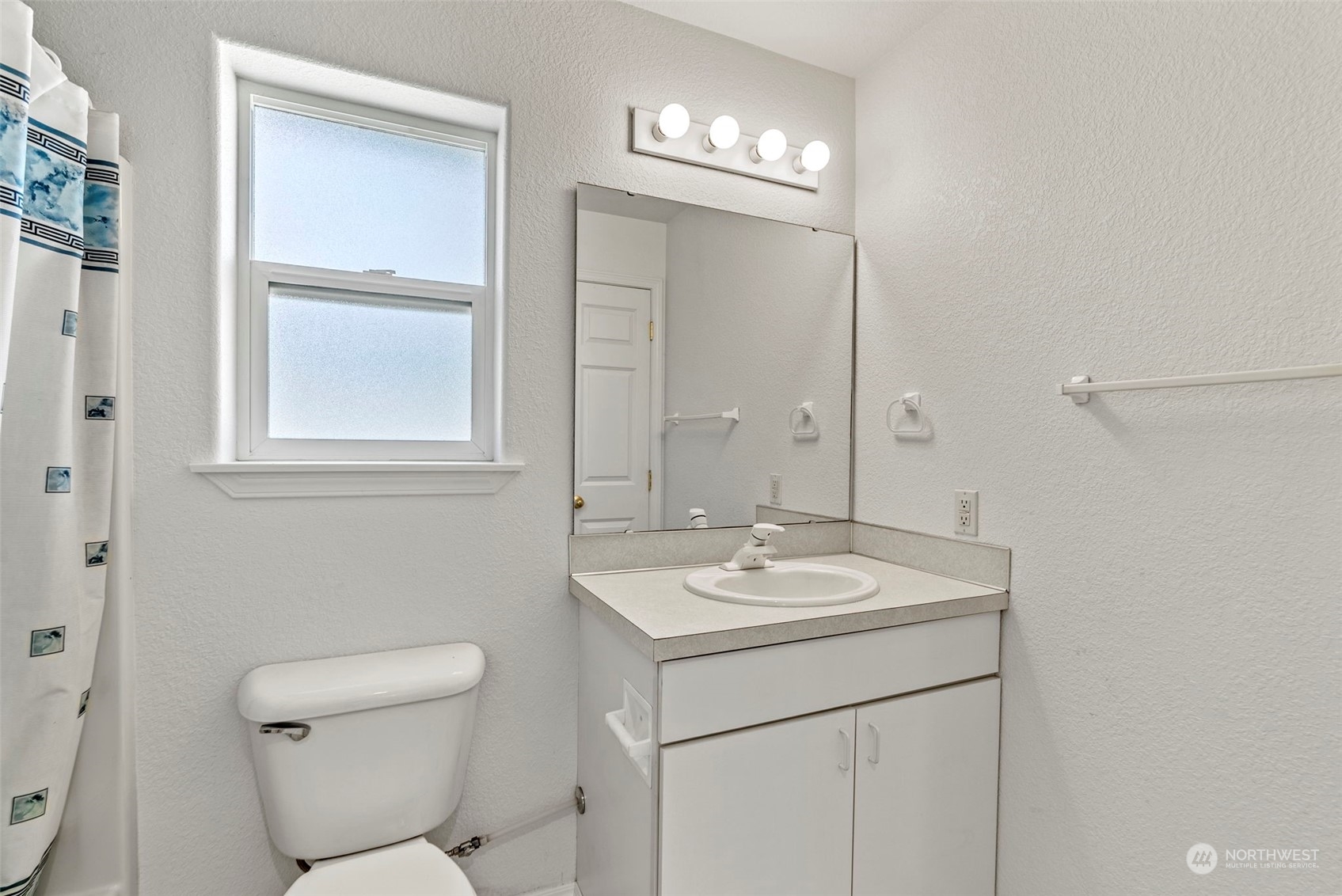18728 Sams Place Southwest Rochester, WA 98579 - Photo 11 of 28 a bathroom with a toilet sink and mirror