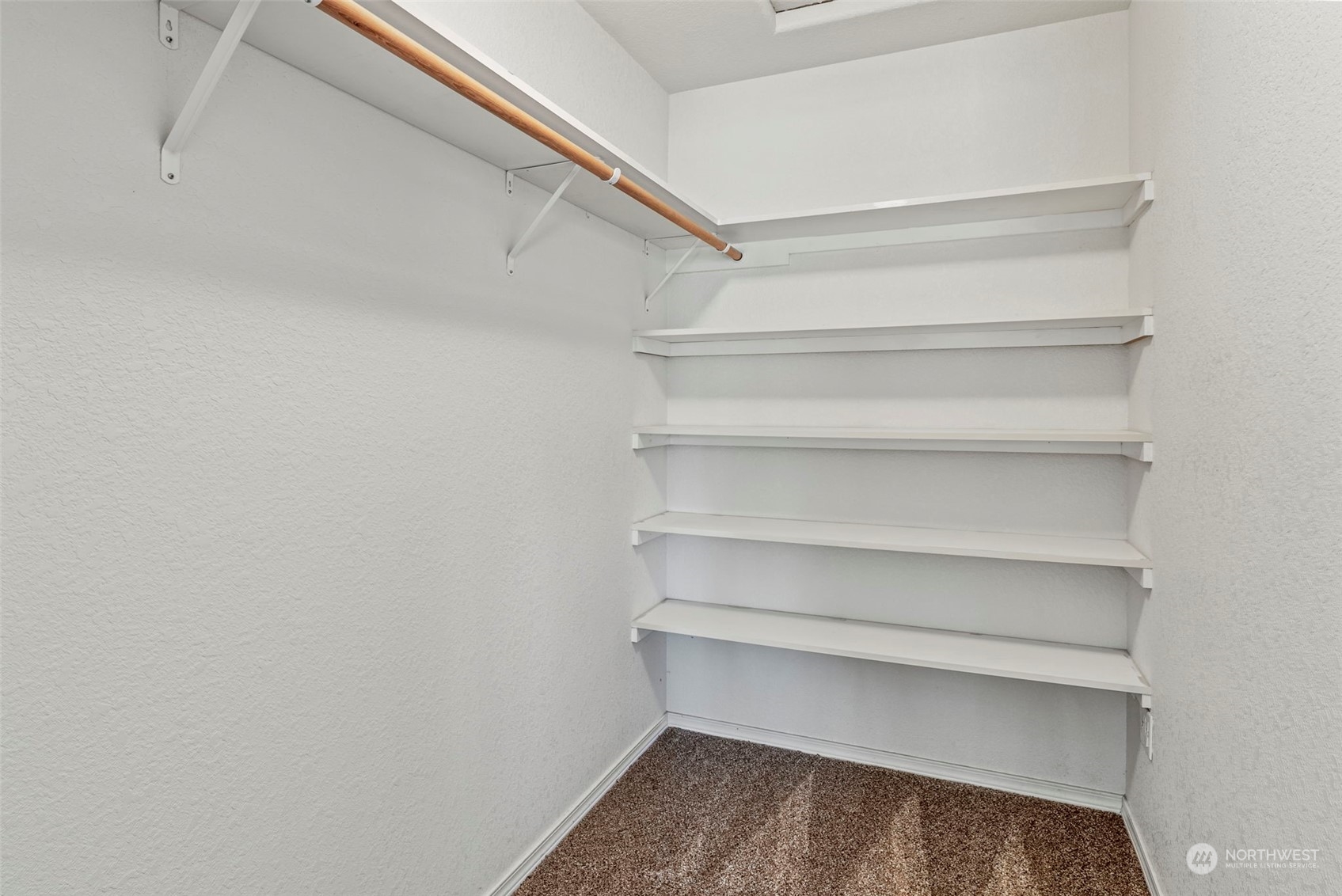 18728 Sams Place Southwest Rochester, WA 98579 - Photo 23 of 28 a view of walk in closet with empty racks
