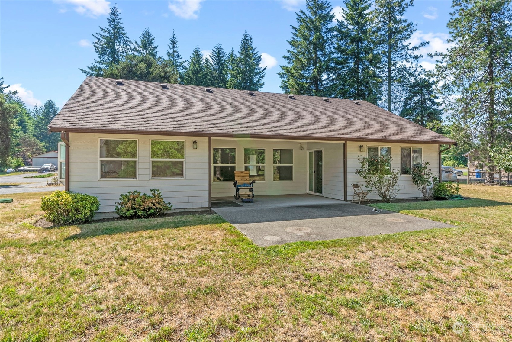 18728 Sams Place Southwest Rochester, WA 98579 - Photo 5 of 28 a view of a house with backyard and garden