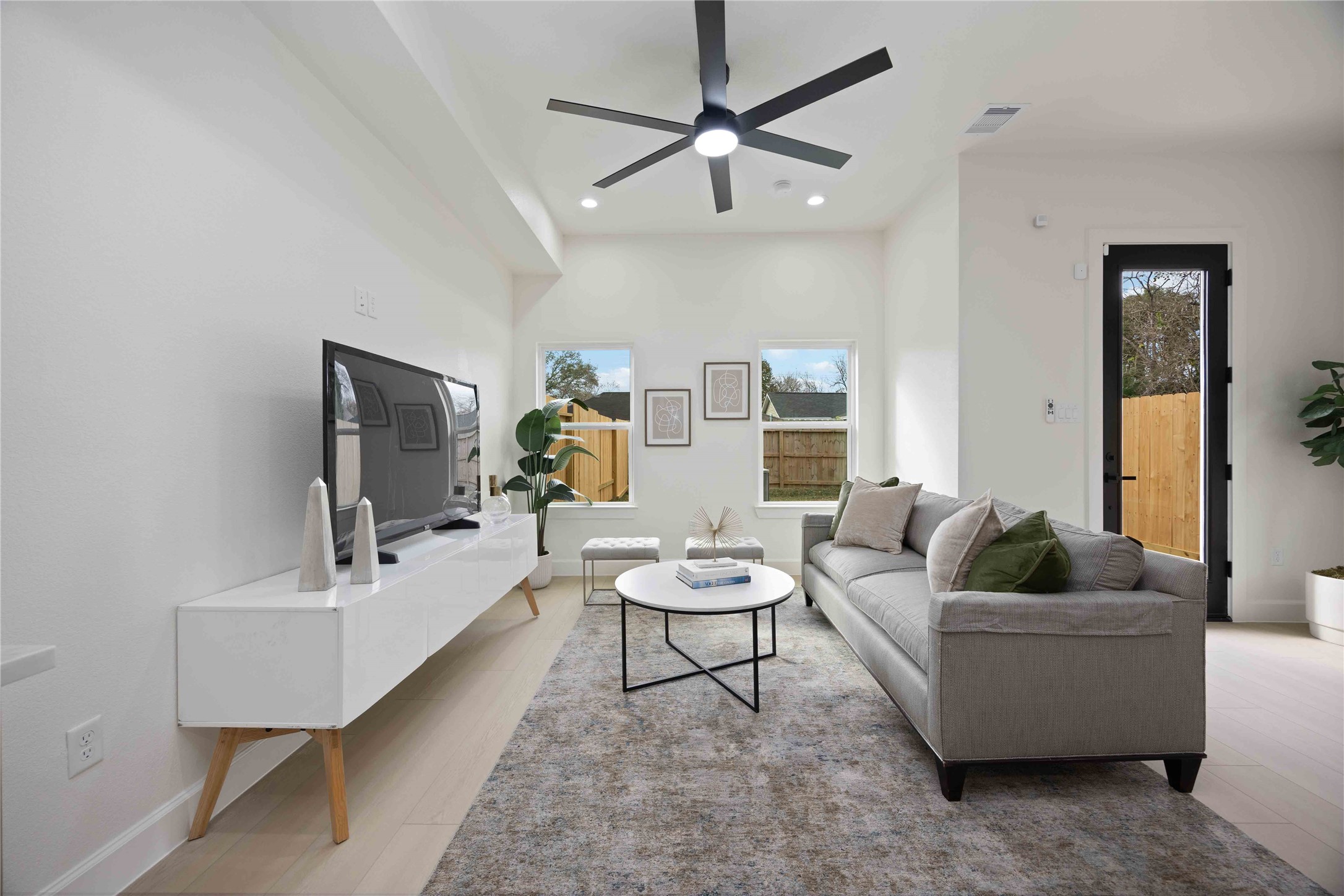 3528 Amos Street Houston, TX 77021 - Photo 12 of 30 a living room with furniture and a flat screen tv