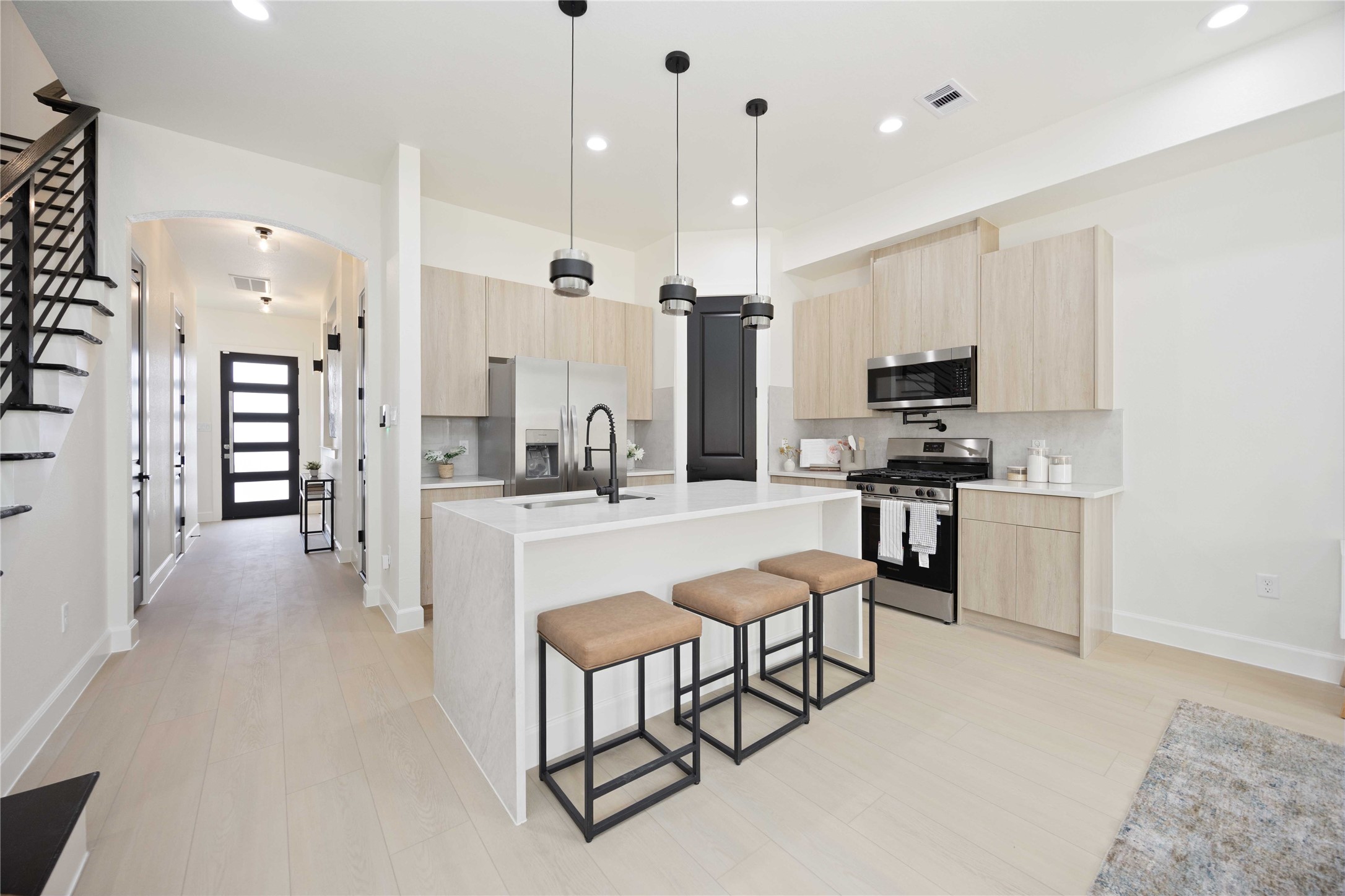 3528 Amos Street Houston, TX 77021 - Photo 7 of 30 a large kitchen with kitchen island white cabinets and stainless steel appliances