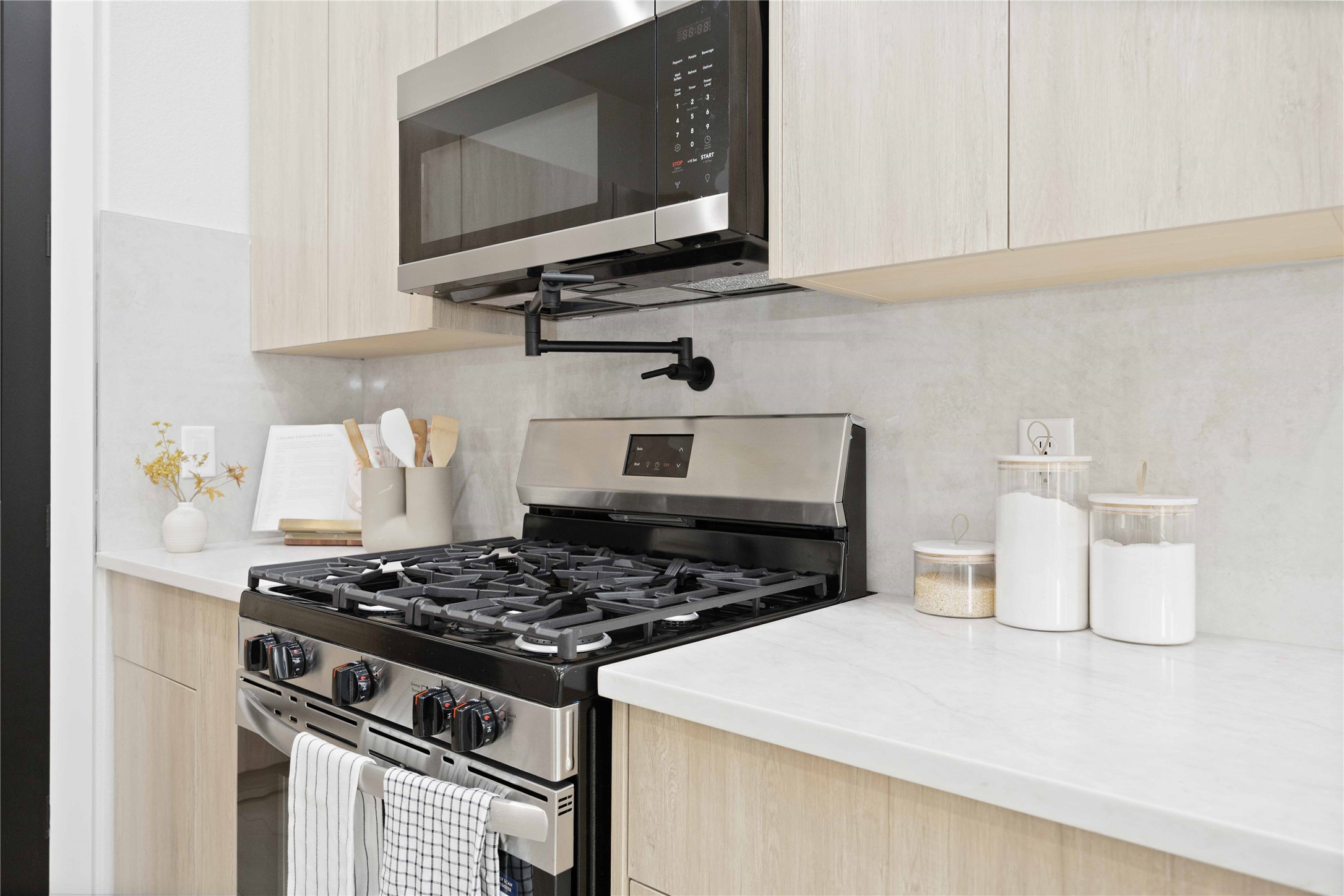3528 Amos Street Houston, TX 77021 - Photo 9 of 30 a kitchen with a stove and a microwave