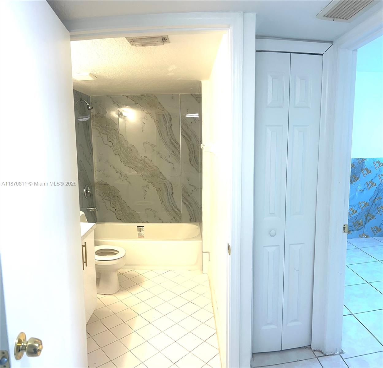 1240 Southeast 28th Court, Unit 101 Homestead, FL 33035 - Photo 13 of 20 a bathroom with a shower
