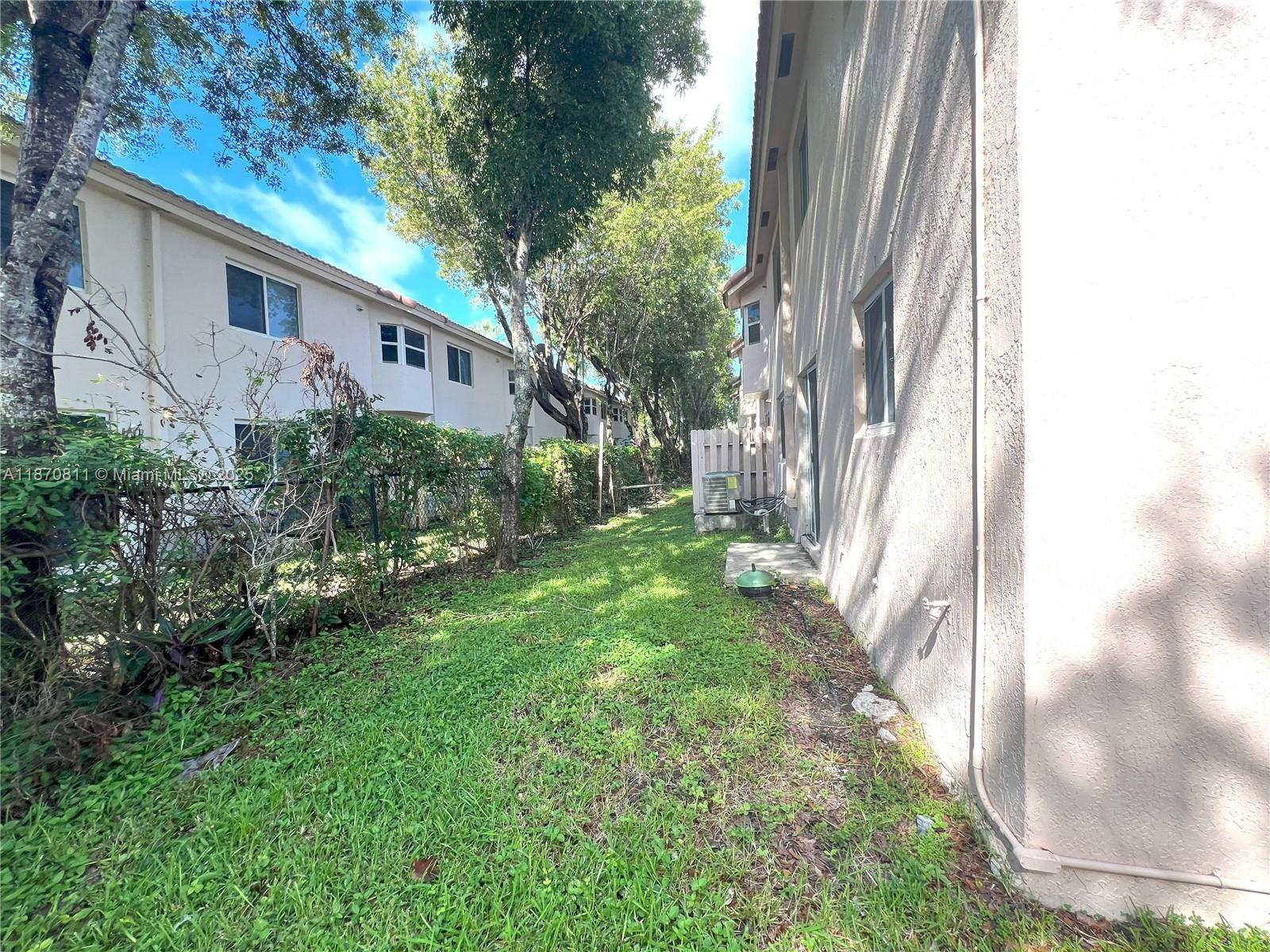 1240 Southeast 28th Court, Unit 101 Homestead, FL 33035 - Photo 19 of 20 a view of a house with a yard