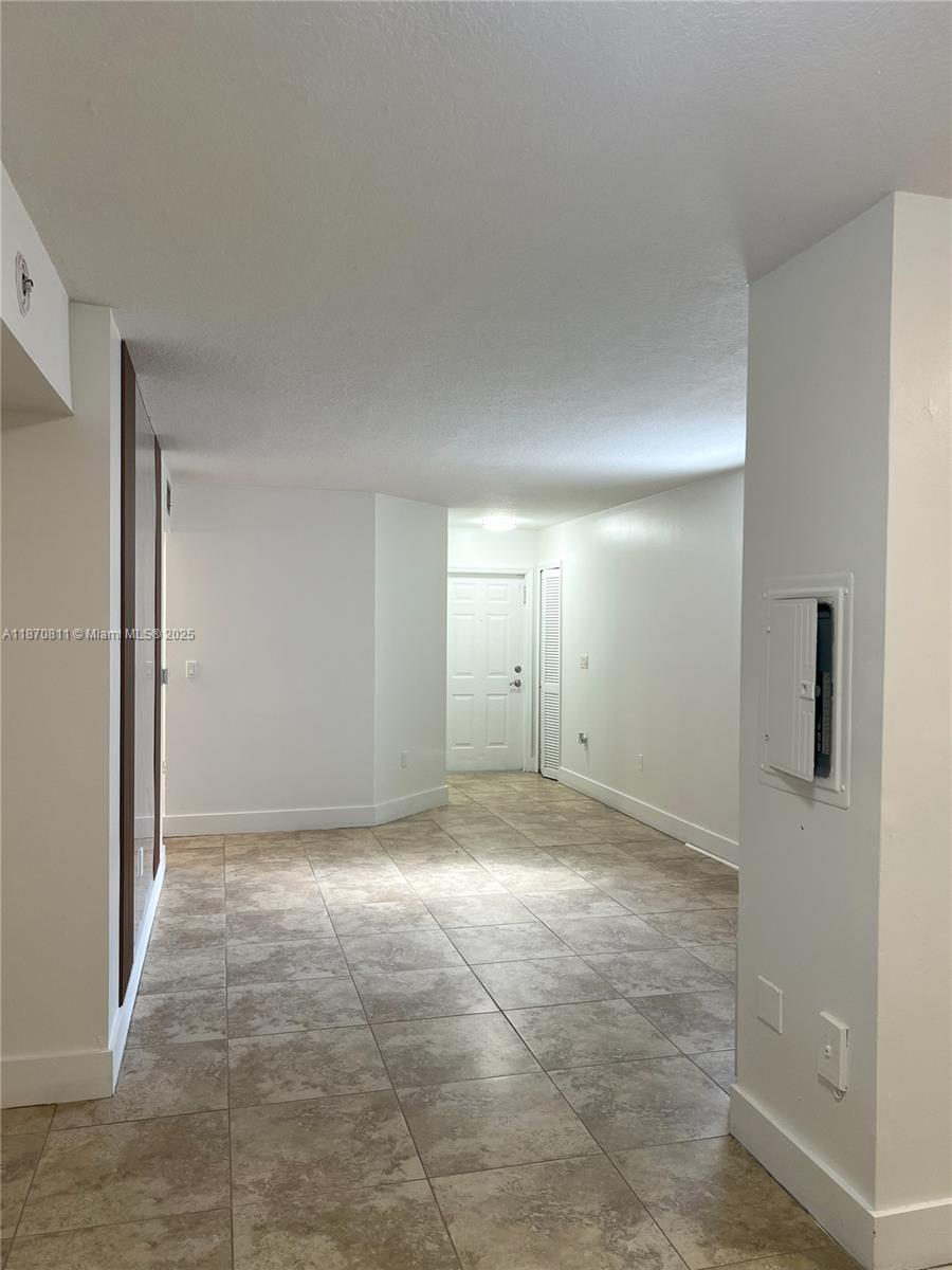 1240 Southeast 28th Court, Unit 101 Homestead, FL 33035 - Photo 2 of 20 a view of an empty room