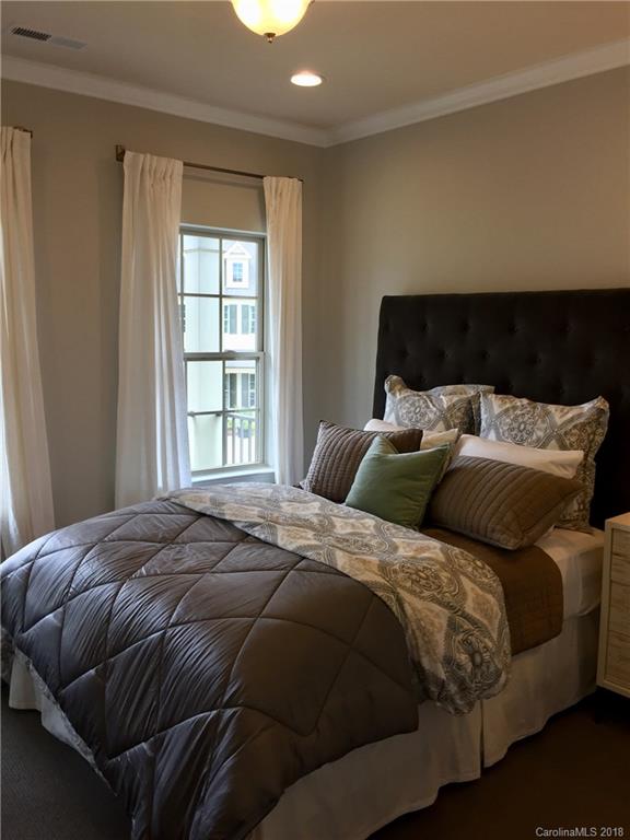 958 Emory Lane, Unit 110 Fort Mill, SC 29708 - Photo 14 of 18 a bedroom with a bed and a window