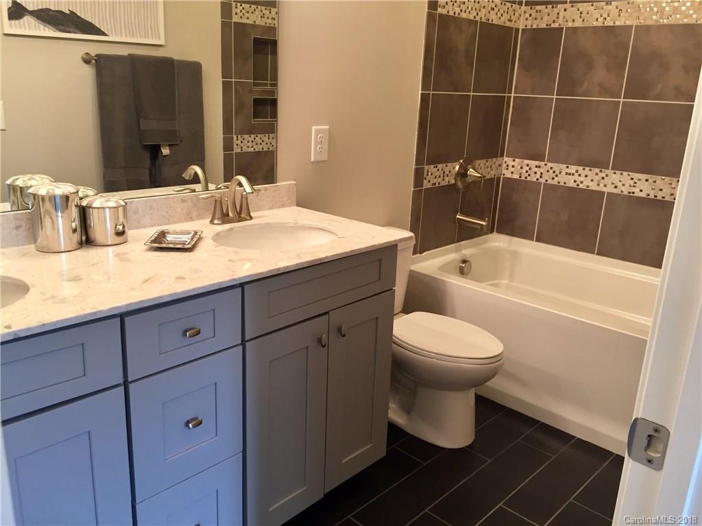 958 Emory Lane, Unit 110 Fort Mill, SC 29708 - Photo 15 of 18 a bathroom with a sink a toilet and shower