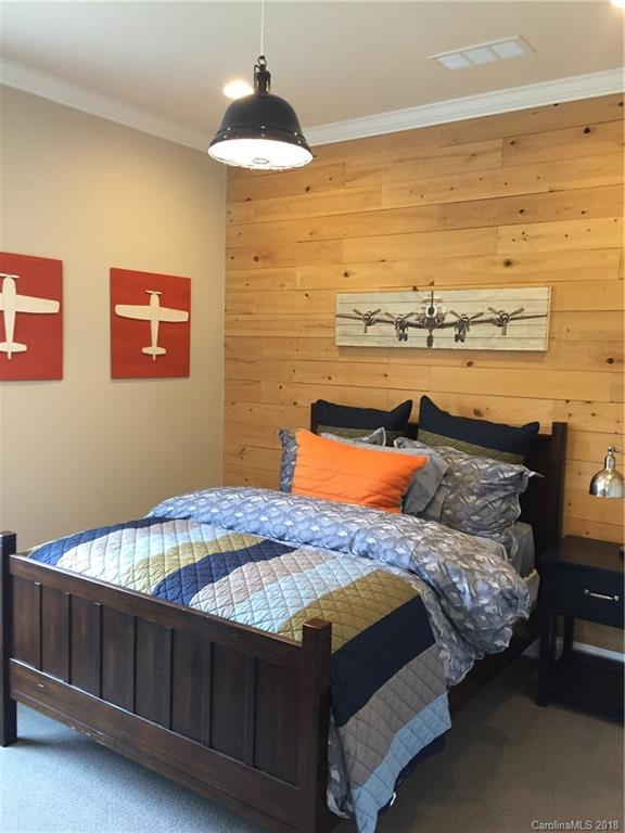 958 Emory Lane, Unit 110 Fort Mill, SC 29708 - Photo 16 of 18 a bedroom with a bed and a walk in closet