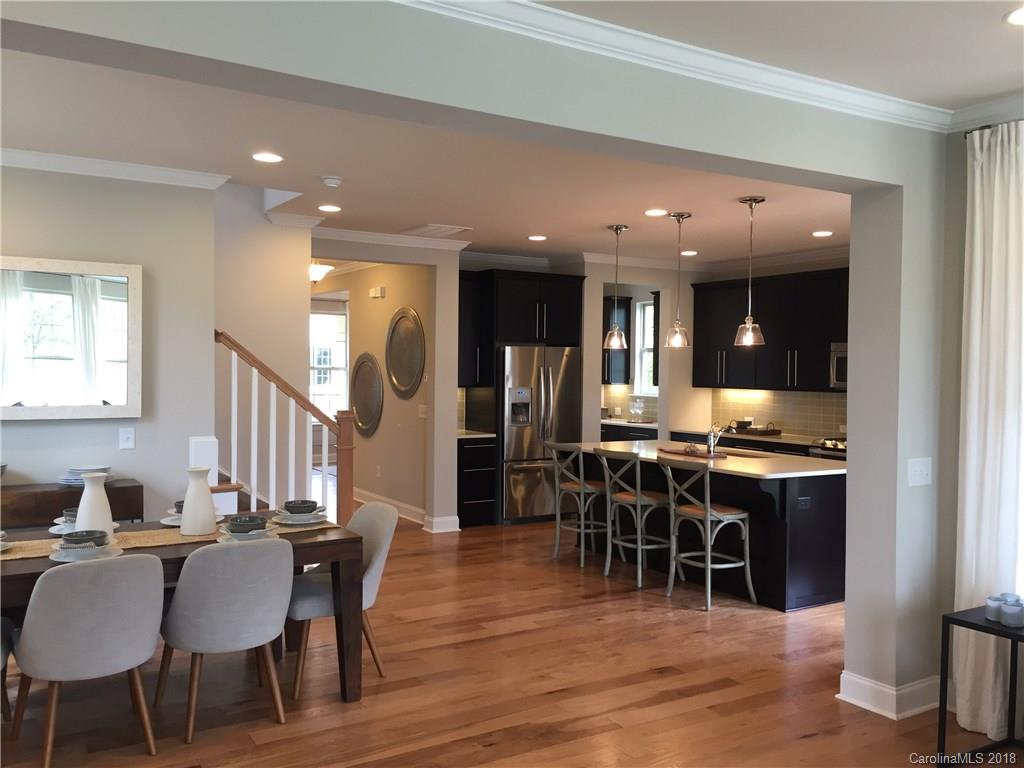 958 Emory Lane, Unit 110 Fort Mill, SC 29708 - Photo 8 of 18 a view of a dining room with furniture