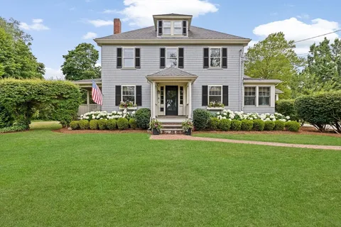 front view of a house with a garden