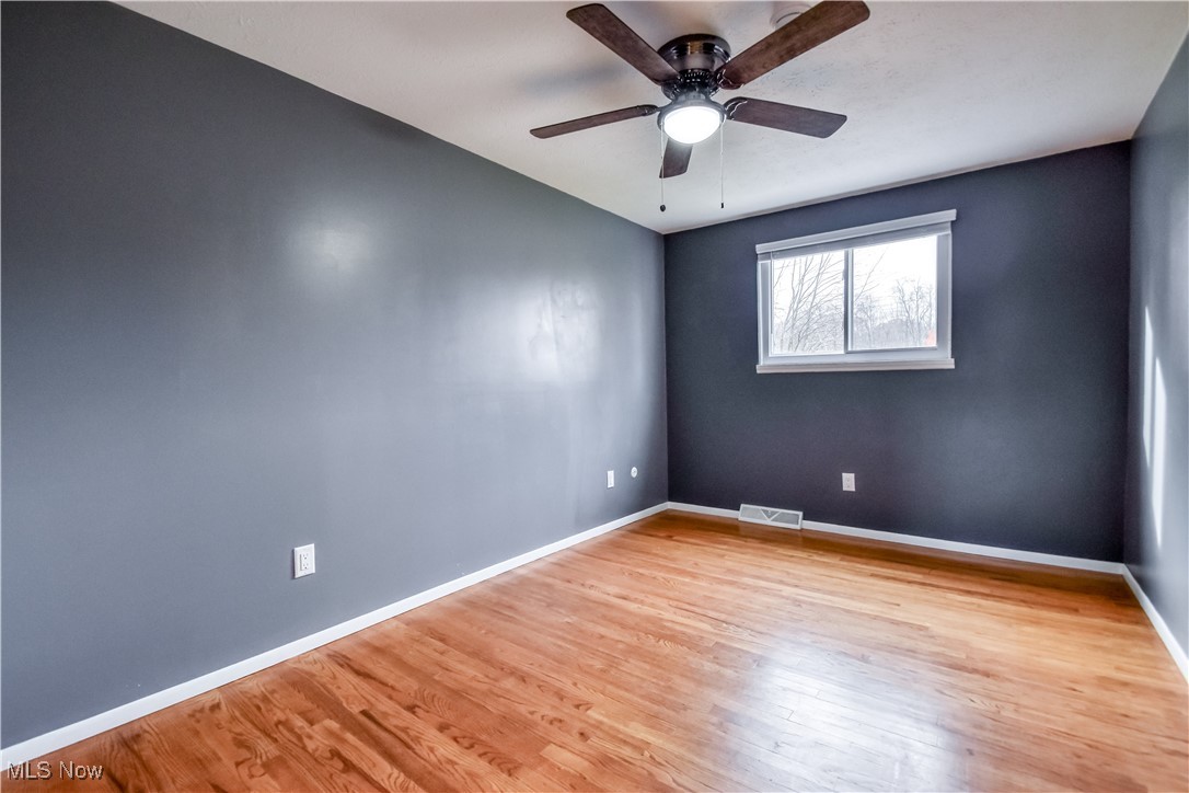 5618 Dolphin Road Mentor, OH 44060 - Photo 28 of 46 Unfurnished room featuring light wood-style flooring and ceiling fan