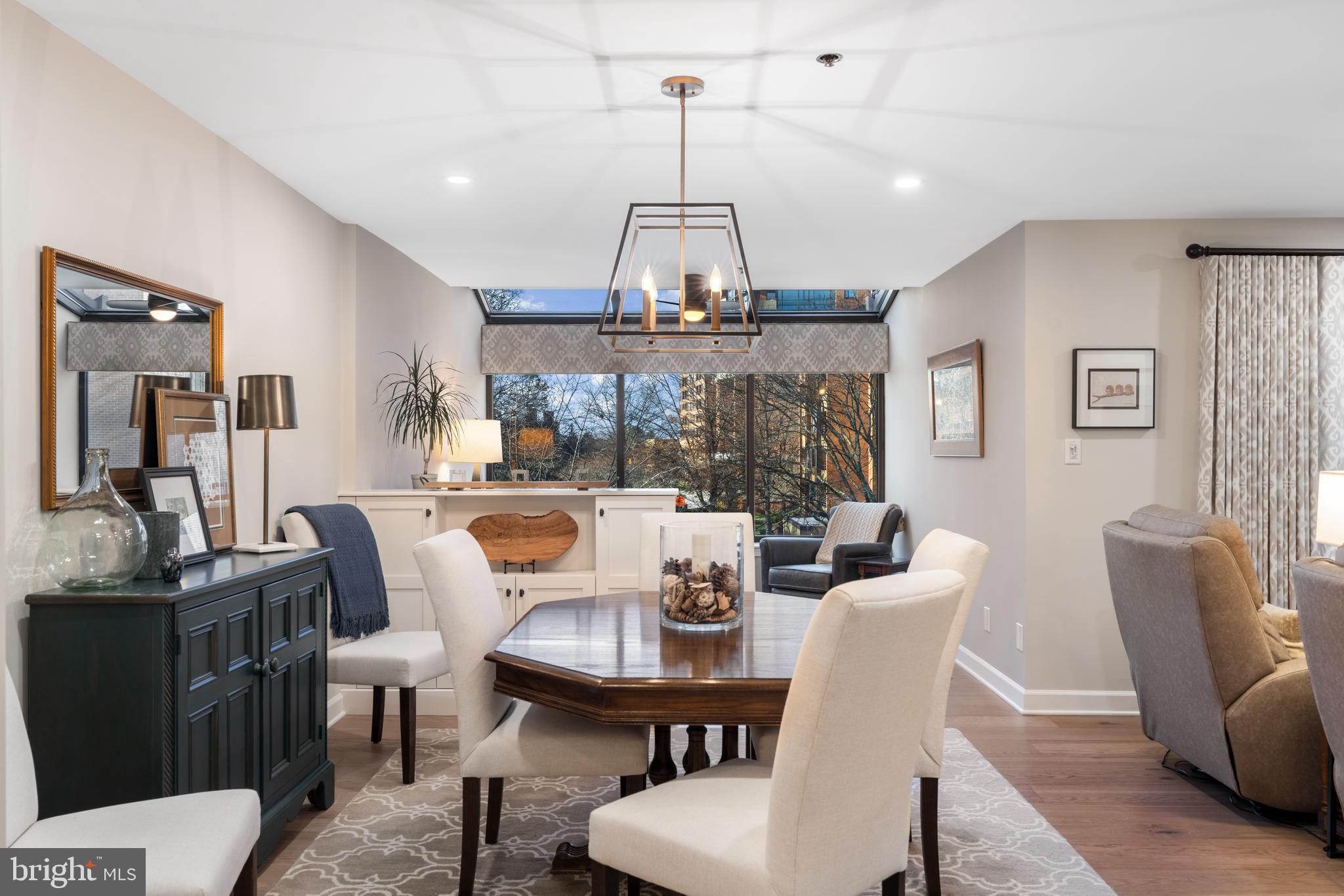 2 Southerly Court, Unit 302 Towson, MD 21286 - Photo 13 of 34 a view of a dining room with furniture window and wooden floor