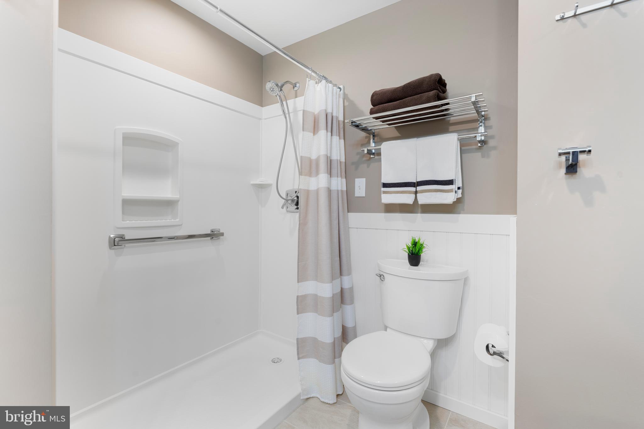 2 Southerly Court, Unit 302 Towson, MD 21286 - Photo 24 of 34 a bathroom with a toilet and a shower