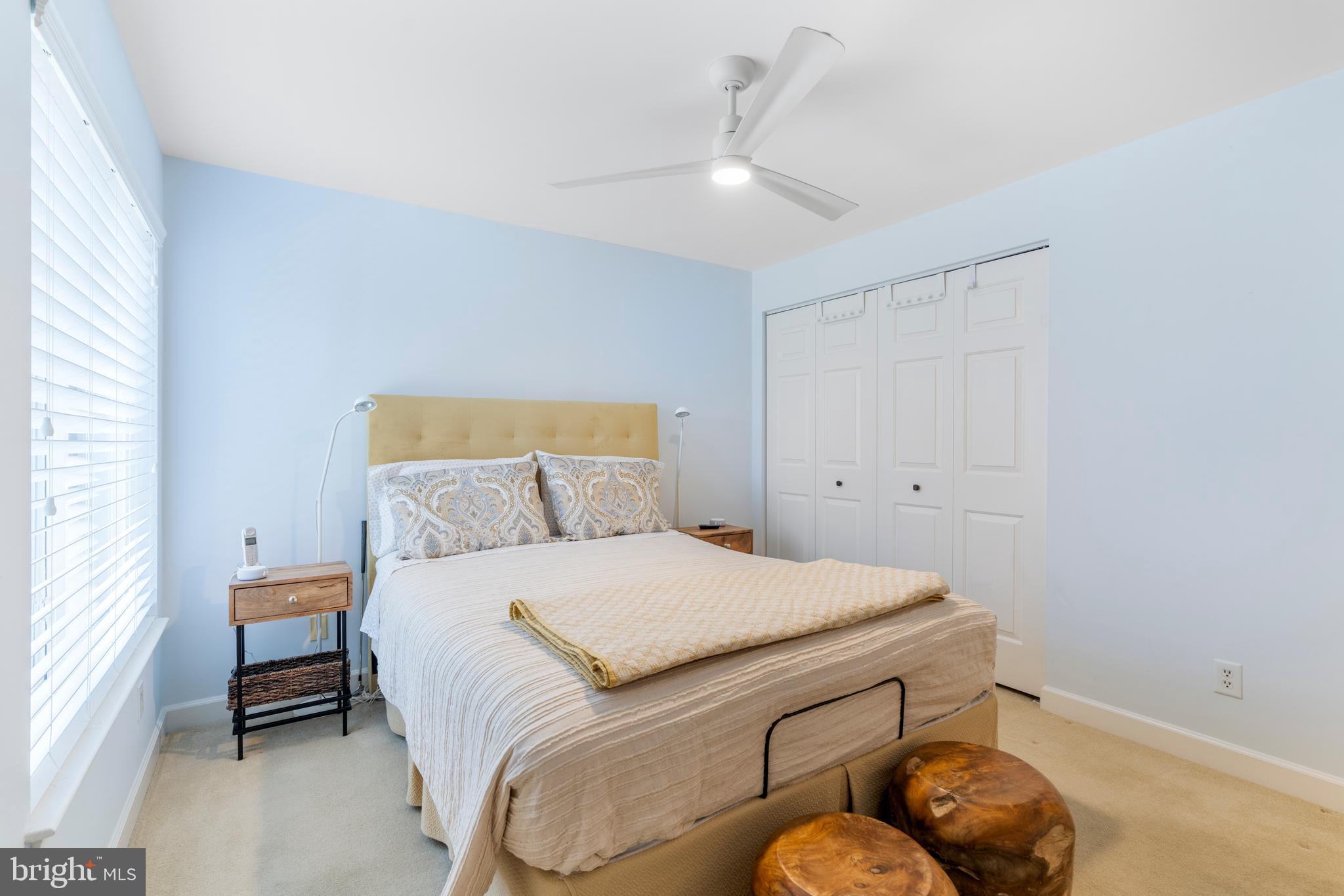 2 Southerly Court, Unit 302 Towson, MD 21286 - Photo 28 of 34 a bedroom with a bed and a chandelier