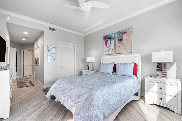 a bedroom with a bed and a view of bathroom