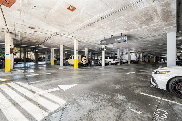 a utility room with fridge dryer and washer