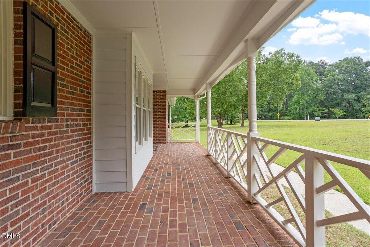 805 Rand Road Garner, NC 27529 - Photo 8 of 38 a view of a balcony with wooden floor