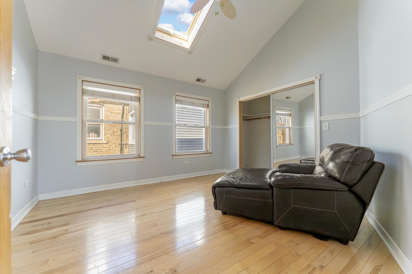 5454 West Eddy Street Chicago, IL 60641 - Photo 12 of 22 a living room with furniture window and a wooden floor